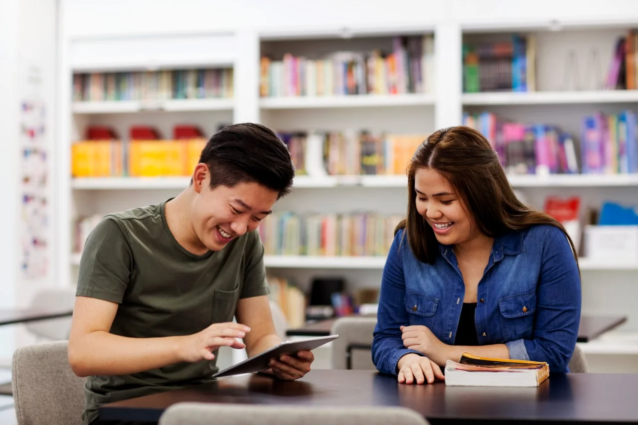 Pair of students studying in the library Pair of students studying in the library